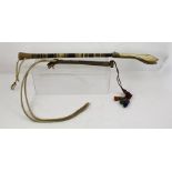 TWO MIDDLE EASTERN TURNED HORN HANDLED WHIPS, one 60cm overall (believed for camel), the other