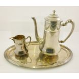 A WHITE METAL PLATED COFFEE SET comprising; pot, tray and milk jug, having pressed garland rim and