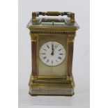 A VICTORIAN GILT AND SILVERED BRASS CARRIAGE CLOCK having Corinthian column case, bi-colour silvered