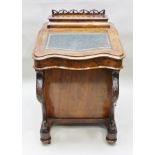 A VICTORIAN WALNUT DAVENPORT DESK, having fret gallery hinged lid box back, the writing slope with