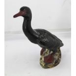 A "BORDEAUX POTTERY" (ISLES OF SCILLY) GLAZED CERAMIC MODEL OF A CORMORANT, perched on a rocky