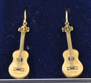 A PAIR OF 9CT. GOLD DROP EARRINGS each with a guitar drop and wire fitting