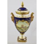 A COALPORT BONE CHINA URN FORM VASE, having cobalt blue ground with hand painted reserve,