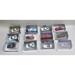A COLLECTION OF TWELVE JAMES BOND 007 DIE-CAST MODEL VEHICLES each contained in acrylic display case