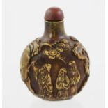 A CHINESE SCENT BOTTLE, possible carved stone, decorated with wise men, 7cm high