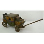 A NAIVE FOLK ART PAINTED WOODEN MAIL COACH, inscribed "Oxford-London", 18cm high, bears paper