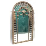 A REGENCY DESIGN GILT METAL FRAMED ARCH TOP PIER MIRROR with anthemion and bell husk swag