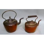 A 19TH CENTURY COPPER KETTLE the cover with acorn finial, together with one other copper kettle