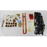 A COLLECTION OF JEWELLERY to include a lava brooch, jet tassel, buttons etc.