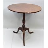 A 19TH CENTURY MAHOGANY SNAP-TOP WINE TABLE on turned column with three arched supports, 62cm