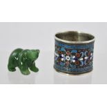 A RUSSIAN SILVER NAPKIN RING, enamelled in red, white and blue, having stylised floral central band,