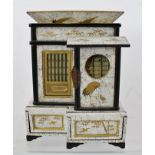 A JAPANESE LACQUER BOX IN THE FORM OF A TEA HOUSE, opening to reveal many compartments for