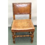 A SET OF FOUR CROMWELLIAN DESIGN OAK FRAMED SINGLE DINING CHAIRS with studded hide seat and backs