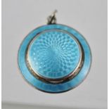 A WHITE METAL AND BLUE GUILLOCHE ENAMEL PENDANT, with hinged cover, 3cm diameter