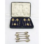 A SET OF SIX LATE VICTORIAN SILVER TEASPOONS with apostle terminals, a pair of silver SUGAR NIPS and