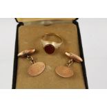 A PAIR OF 9CT. ROSE GOLD CUFFLINKS and a 9ct. gentleman's SIGNET RING with oval polished stone inset