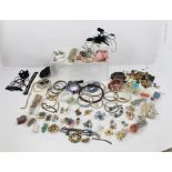 A QUANTITY OF COSTUME JEWELLERY, including necklaces, bangles, rings, pendants etc.