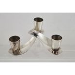 CARL F. CHRISTIANSEN A DANISH SILVER PLATED CANDLE HOLDER, of propeller design with three sconces,