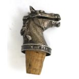 N.B. & SON (possibly Nathan Bloom & Son) A CAST SILVER BOTTLE STOP POURER, in the form of a horse'