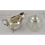 HARRISON BROS A CHIPPENDALE STYLE SILVER SAUCE BOAT having cut shaped rim, up-scrolled handle and