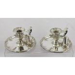 ELKINGTON & CO. A PAIR OF SILVER PLATED CHAMBER STICKS with snuffers, each engraved with lion