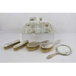 ADIE BROTHERS LIMITED A SILVER DRESSING TABLE SET, comprising a vanity hand mirror, two pairs of