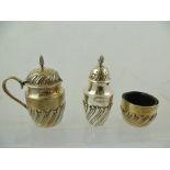 DEAKIN & SONS A VICTORIAN SILVER THREE PIECE CONDIMENT with pressed swirl fluted lower belly