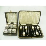 A CASED SET OF SILVER TEASPOONS AND CLAW TERMINAL SUGAR NIPS, Birmingham 1935, together with a cased