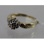 A 9CT GOLD DIAMOND CLUSTER RING, size M 1/2