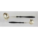 A GRADUATED PAIR OF 18TH CENTURY STYLE SWEDISH SILVER COLOURED METAL TODDY LADLES, each having