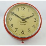 A "SMITHS" ELECTRIC WALL CLOCK, the Bakelite case painted red, the dial with Arabic numerals,