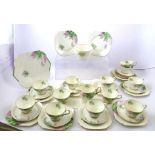 A SHELLEY TEA SET FOR TWELVE, having hand coloured floral transfer design, comprising 12 cups, 12