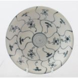AN EARLY 19TH CENTURY CHINESE DISH, salvaged from the "Tek Sing", off white base with hand painted