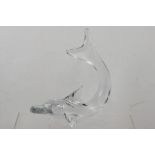 A LATE 20TH CENTURY CLEAR GLASS MODEL OF A DOLPHIN, signed Daum, France, 24cm high x 24cm long