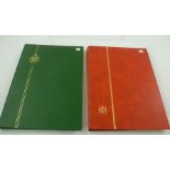 A RED STOCKBOOK containing a World collection, includes some better, mainly Swiss issues, and A