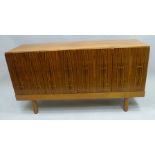 A 1970's GORDON RUSSELL "AFORMOSA" AND "RIO" ROSEWOOD FOUR-DOOR SIDEBOARD, designed by W.H. "Curley"