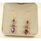 A PAIR OF EDWARDIAN STYLE GOLD COLOURED METAL SET AMETHYST, DIAMOND AND SEED PEARL DROP EARRINGS,