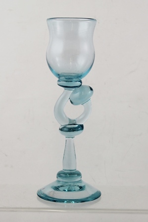 KARLIN RUSHBROOKE A PALE BLUE STUDIO GLASS with fancy shaped stem, on plain conical foot, 24cm high
