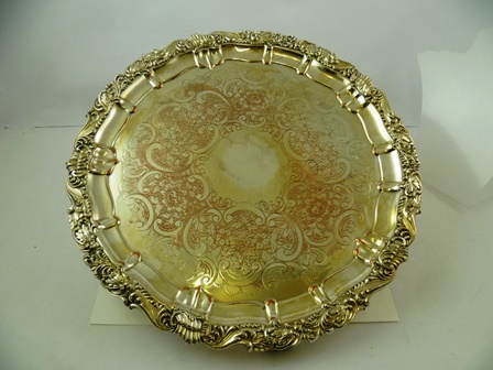 A 20TH CENTURY EPNS DRINKS TRAY having scroll applied border, ornamental tooled centre (uninscribed)