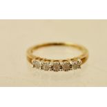 A DIAMOND FIVE STONE HALF HOOP RING having uniform brilliants, illusion set in 9ct gold setting,