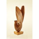 A 20TH CENTURY CARVED AND POLISHED WOOD STYLISED BIRD SCULPTURE, on square block base, 50.5cm