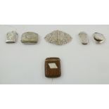 A SELECTION OF SILVER VESTAS AND OTHER ITEMS comprising; a leather clad vesta and two others spot