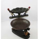 TWO 20TH CENTURY PAINTED AND GILDED COMPOSITION BLACKAMOOR BOWLS, each with two supporters, the