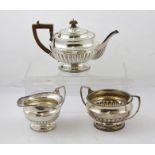 HARRY FREEMAN A THREE PIECE SILVER TEASET, each having gadroon rim and demi reeded lower belly on
