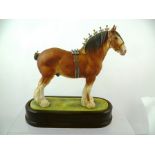 A ROYAL WORCESTER PORCELAIN CLYDESDALE STALLION modelled by Doris Lindner, 24.5cm high, in