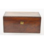 AN EARLY 19TH CENTURY CASKET FORMED TEA CADDY with bead edge lift-up top and remains of fitted