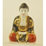 A JAPANESE CERAMIC SATSUMA BUDDHA polychrome enamel painted with gilt highlights, 21cm high