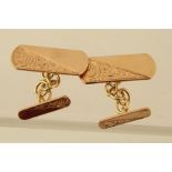 A PAIR OF GOLD COLOURED METAL CHAIN LINK CUFFLINKS, each having bright cut tooled pads, un-