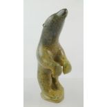 AN INUIT CARVED SOFT STONE MODEL OF A POLAR BEAR, label to base "Moshe Kelly - Frobisher Bay", 24.