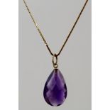 A SINGLE STONE AMETHYST ON CHAIN, having a pear cut stone on fancy gold coloured metal S-link chain